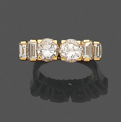 null River ring in 750 mils yellow gold set with two brilliant-cut diamonds and two...