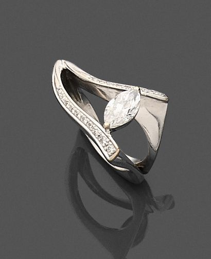 null RING in 750-mil white gold, the asymmetrical bezel set with a navette diamond...