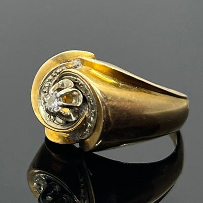 null Yellow gold 750 mil. signet ring, the tourbillon bezel set with white gold claw-set...