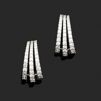 Pair of earrings in white gold set with diamonds...