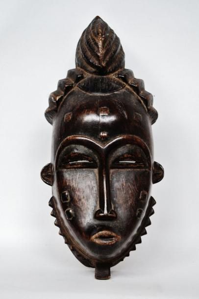 null BAOULE Côte d'Ivoire Masque facial portant une coiffe très élaborée faite d'un...