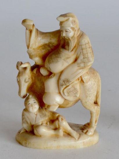 null OKIMONO en ivoire, sage assis sur un buffle, probablement Lao Zi, japon XIXe....