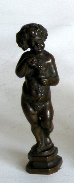 null CACHET en bronze à décor d enfant bachique