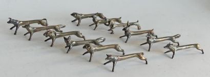 null DOUZE PORTE COUTEAUX en métal argenté en forme d'animaux stylisés (quelques....