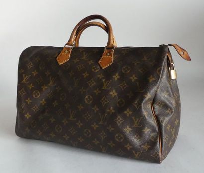 null Louis VUITTON. Sac Speedy en toile siglée et cuir naturel, avec cadenas, sans...