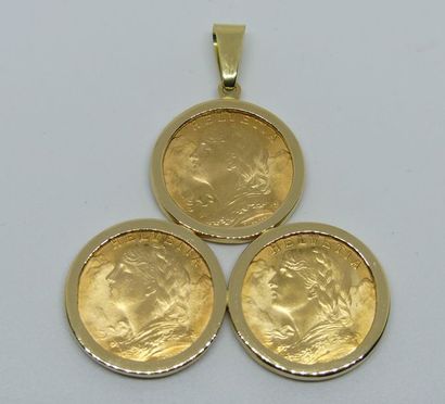 null PENDENTIF en or jaune formé de trois pièces de 20 francs suisse. Poids 25,8...