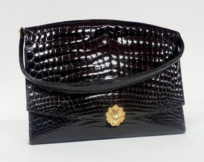 null DIOR. Sac en croco noir, fermoir coquille en métal plaqué or. Etat neuf