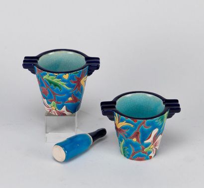 null LONGWY. Pair of small mortars and a pestle in enamels with vegetal decoration...