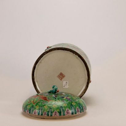null CHINA, 20th century. Cylindrical covered porcelain box with lotus and fish decoration...