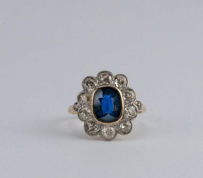null Daisy ring adorned with an oval sapphire of about 2.50 carats (gemstones) set...