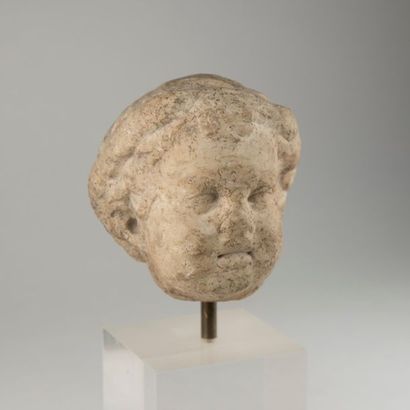 null White marble boy's head, probably antique work. Wear H: 13 cm.