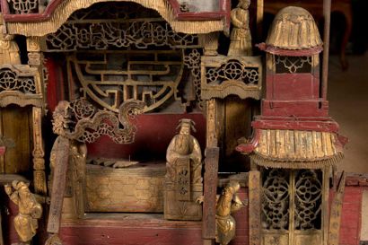 null CHINA. Carved wooden altar, burgundy painting and gilding decorated with a temple...