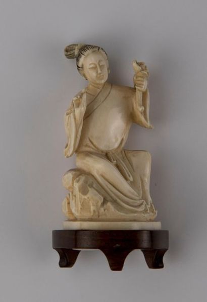 null JAPAN. Two sculpted subjects: woman holding a flower and man playing with her...