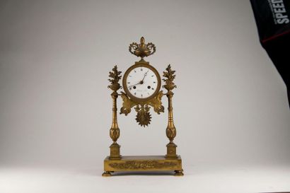 null Portal clock in chased and gilded bronze in neoclassical style, the enamelled...