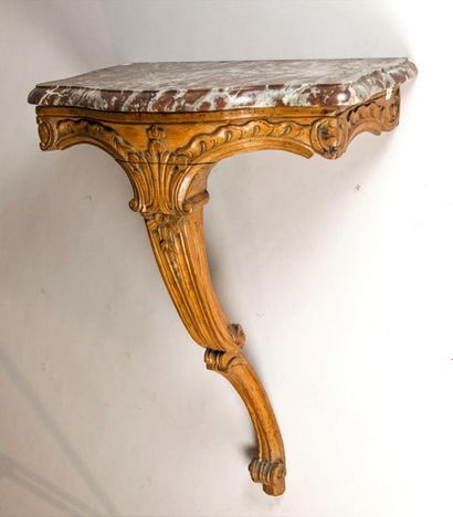 null Small console in walnut molded and carved with palms and foliage. Moulded top...