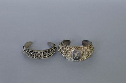null THAILAND. Two silver bracelets with filigree decoration, one with dancer's enamel...