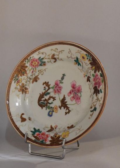 null China, 18th century. Pink family porcelain plate decorated with peonies and...