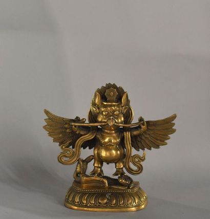 null Tibet, 20th century
Statuette of Garuda in gilded bronze, standing crushing...