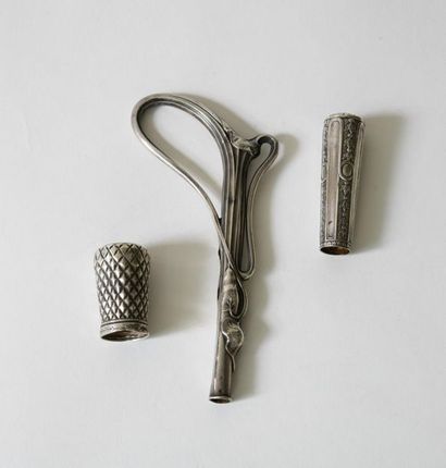 null Set of three hollow and repoussé silver cane pommels, one with alternating ribs...