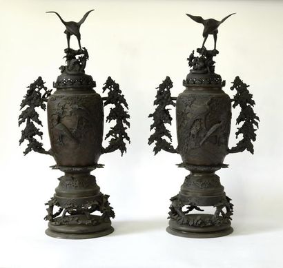 null Indochina, 20th century. Pair of covered bronze vases decorated with birds and...