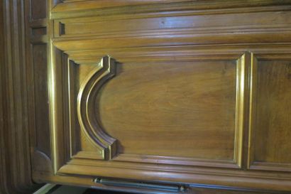 null *Moulded and carved walnut cabinet on slightly arched legs and moving belt....