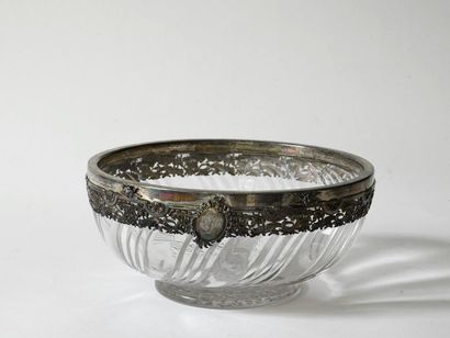 null An important cut crystal bowl with torsos ribs, the silver frame is openworked...