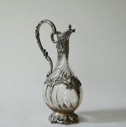 null Crystal decanter with twisted ribs, the silver frame in rocaille style decorated...