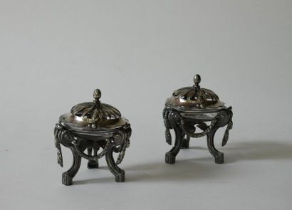null Pair of tripod chiselled silver saltcellars decorated with garlands in the neo-classical...