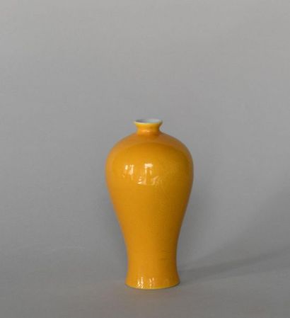 null CHINA. Incised porcelain vase with dragon decoration on a yellow background....