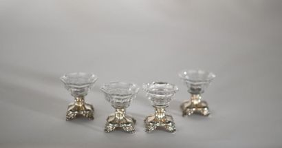 null Suite of four saleron in crystal cut in pans, the polylobate base in silver....