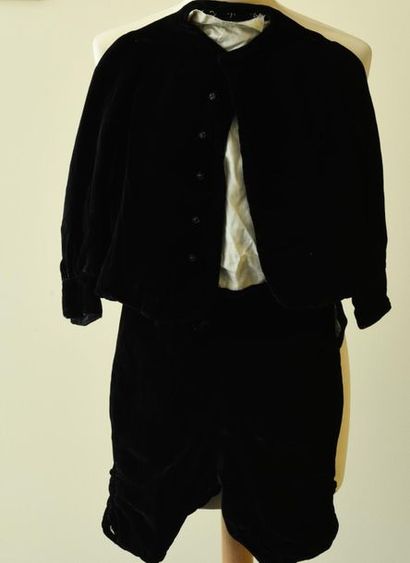 null Two sets of black velvet boy's jackets and short pants.
4-5 years and 8 years...