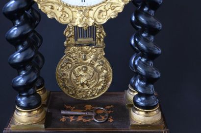 null Portico clock in veneer wood, twisted columns, enamelled dial signed Lafarge...