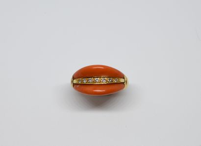 null 1960s ring set with a line of seven 8x8 diamonds shouldered by two natural coral...