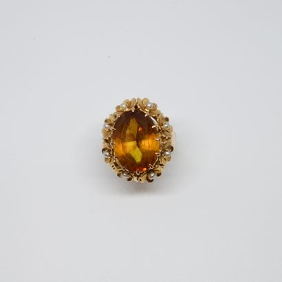 null 1940s ring set with an amber citrine in a decoration of small flowers adorned...