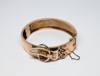 null Bracelet jonc ouvrant ancien en or jaune 750 ‰ avec sa chaînette de sécurité,...