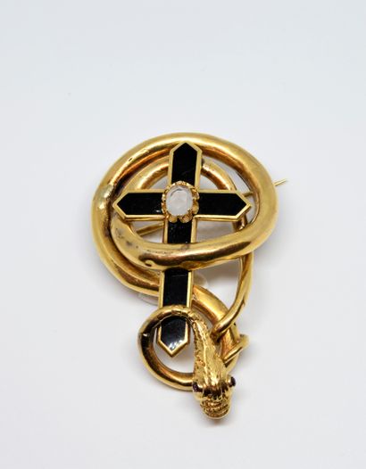 null Napoleon III period brooch composed of a snake coiling around a cross. The setting...