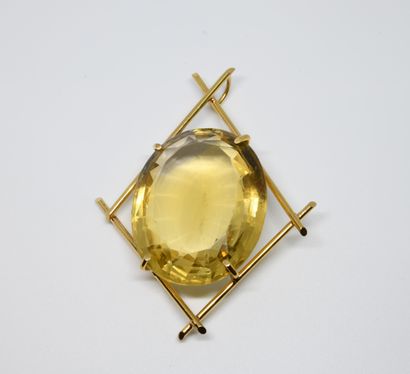 null 1960s geometric pendant adorned with a large oval-shaped fully faceted citrine,...