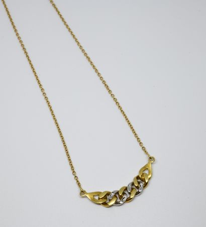 null Collier en or jaune 750 ‰ à motif central type gourmette ornée de quatre petits...