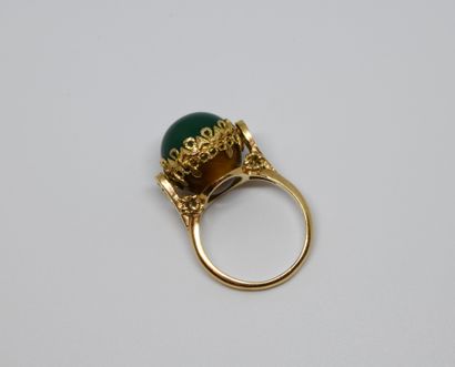 null Reverso ring adorned with a sphere composed of a tiger's eye cabochon on one...