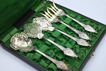 null A five-piece silver and vermeil entremet service, decorated with floral scrolls...