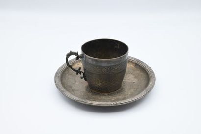 null Silver cup and saucer, with braided pattern and foliage. 

The saucer engraved...