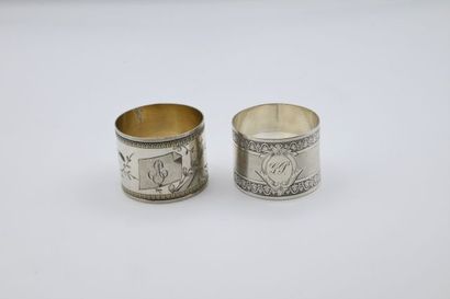 null Two silver napkin rings, one guilloche with stripes and engraved with stars...