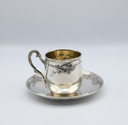 null Cup and saucer with rocaille style design of stylized shells and flowers. 

Mark...
