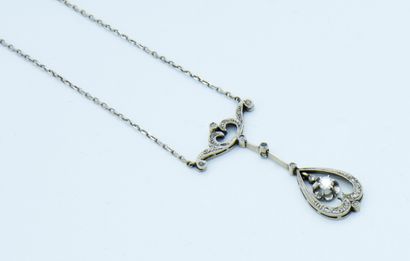 *Small white gold necklace holding an openwork...