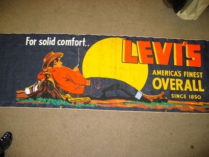 Levi's. Années 50 ? Bannière publicitaire en denim représentant un cow-boy couché...