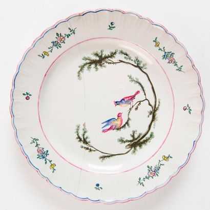 MARSEILLE, Robert Deux assiettes en faïence: l'une à décor floral polychrome, usagée;...