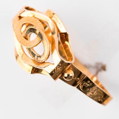 null Bracelet jonc articulé à décor floral ciselé, en or jaune 18 carats (750 millièmes),...