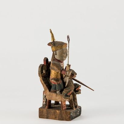 null CHINE DU SUD, XIXème-XXème siècle. Personnage royal sur un trône en bois sculpté...