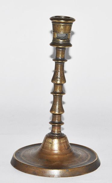 Bronze candlestick with shaft with two balusters...