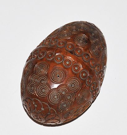 Egg-shaped corozo rosary case with concentric...